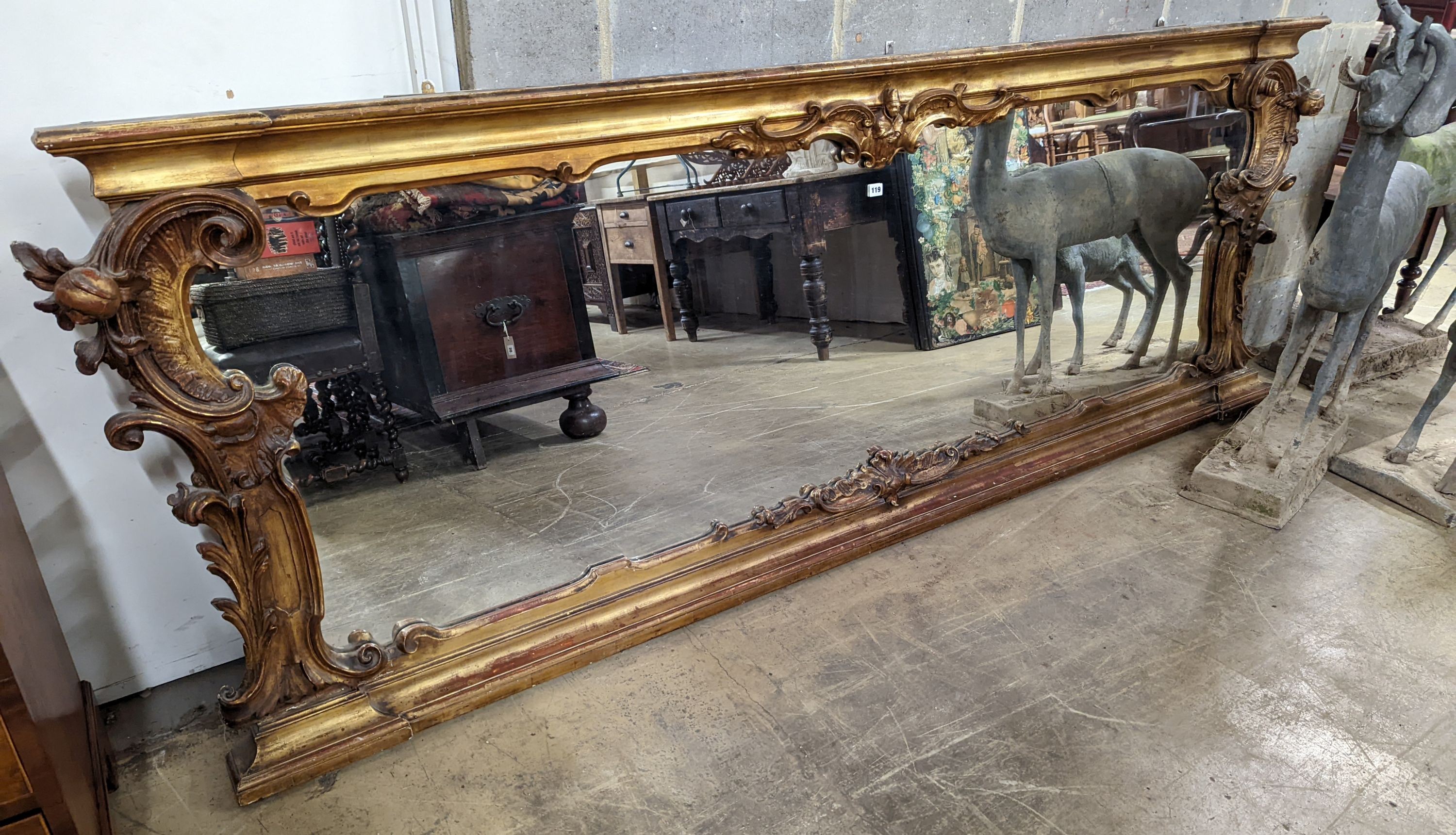 A large Victorian gilt framed landscape overmantel mirror. W-260cm, D-11cm, H-96cm.